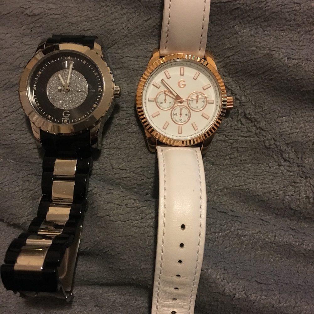 Black and silver guess watch and white guess watch